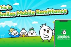 This is smiles mobile remittance, tori family excited and one of them holding he Smiles Mobile Remittance app.